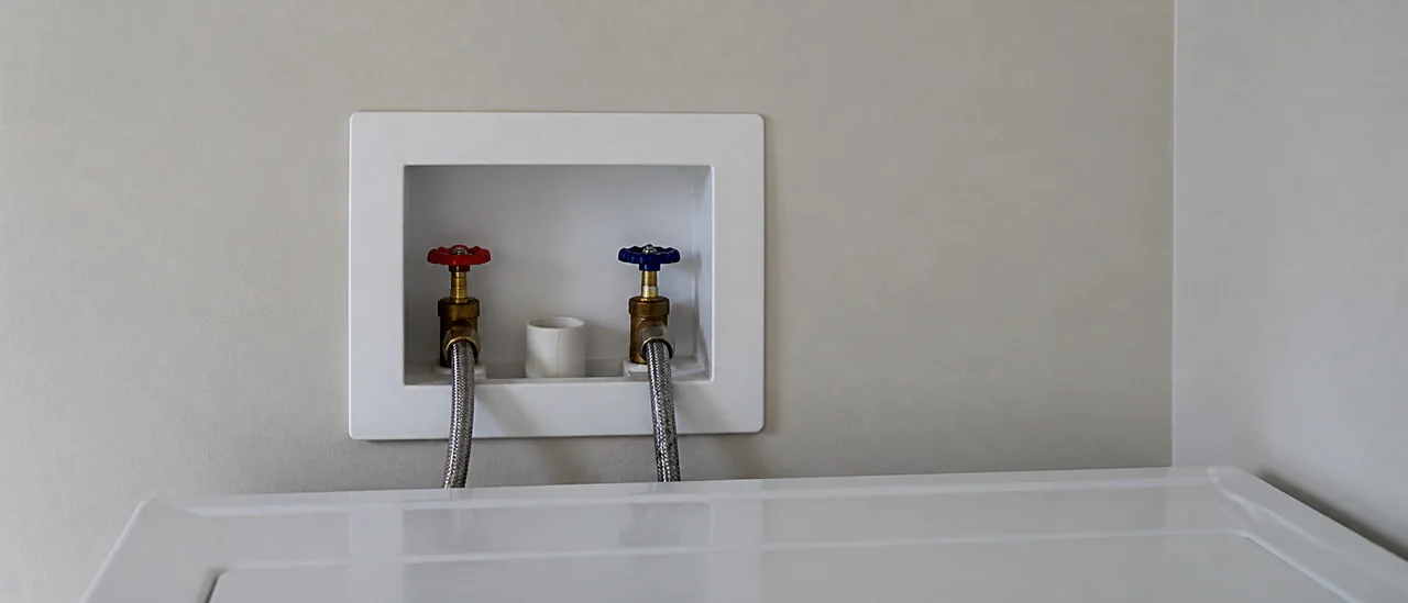 Educational illustration explaining what do missing laundry shutoff valves mean on a home inspection.