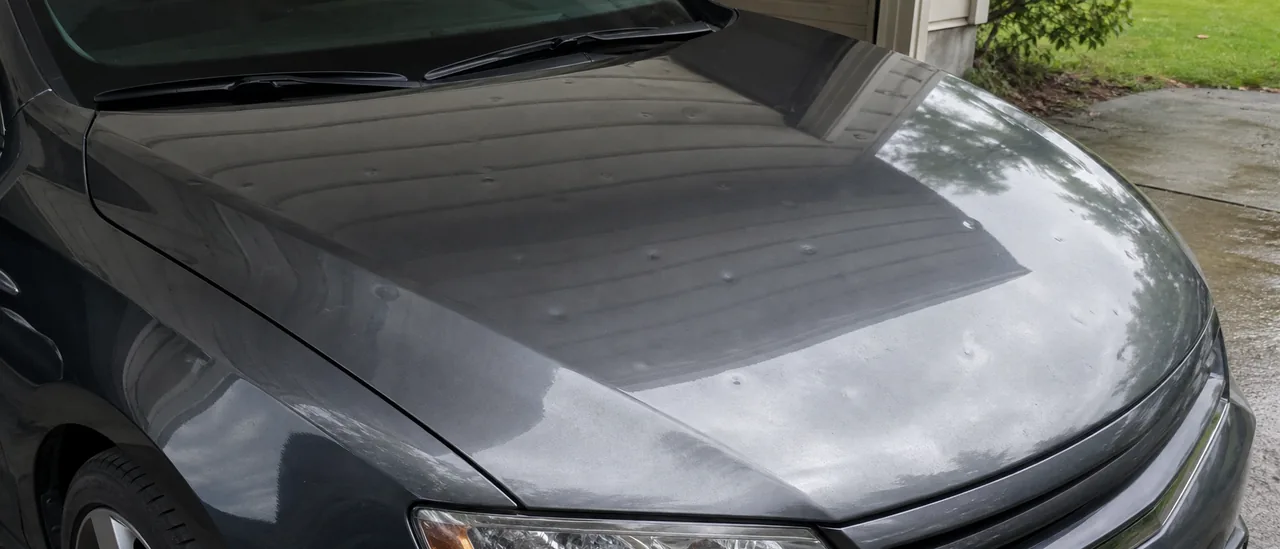 Educational illustration explaining can hail damage show up later on a car.