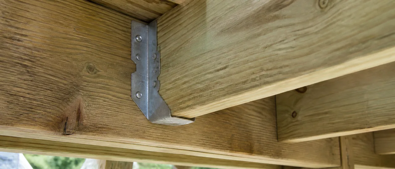Educational illustration explaining what do missing joist hangers mean on a home inspection.
