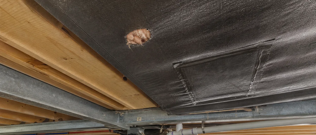 Educational illustration explaining how much does it cost to fix mobile home belly wrap damage.